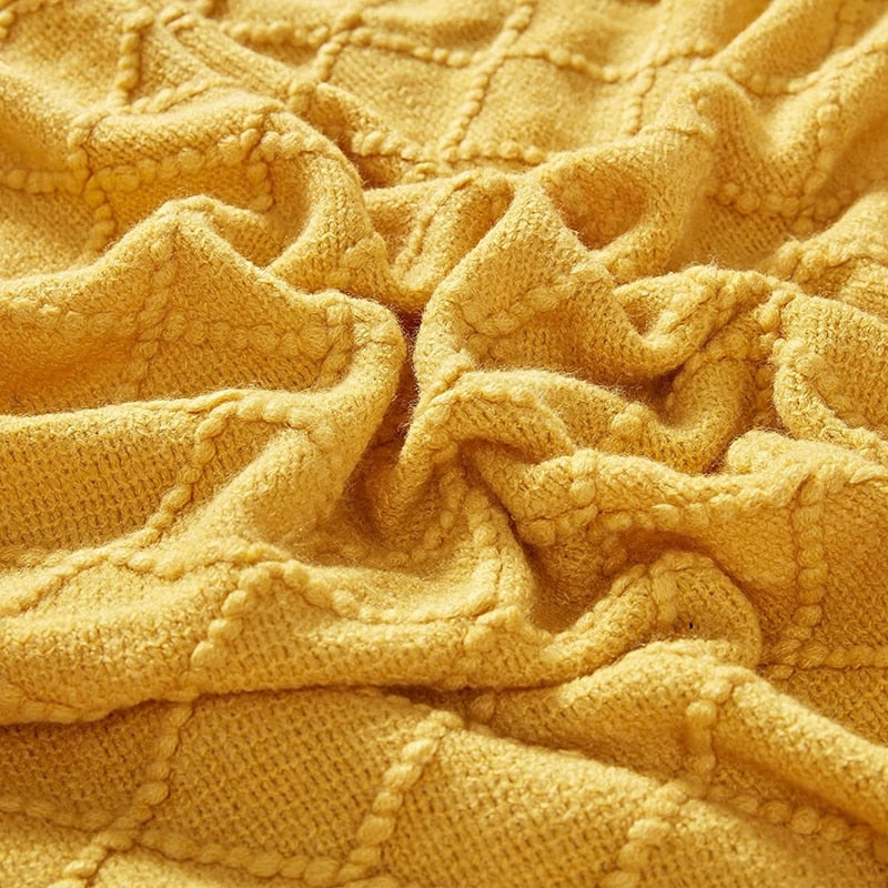 Plaid tricoté à franges